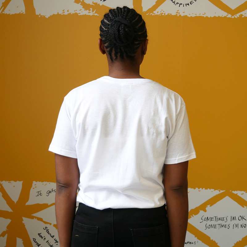 The back of a woman wearing our Nina Bombina bespoke 'You are not alone' graphic #HelloYellow T-shirt