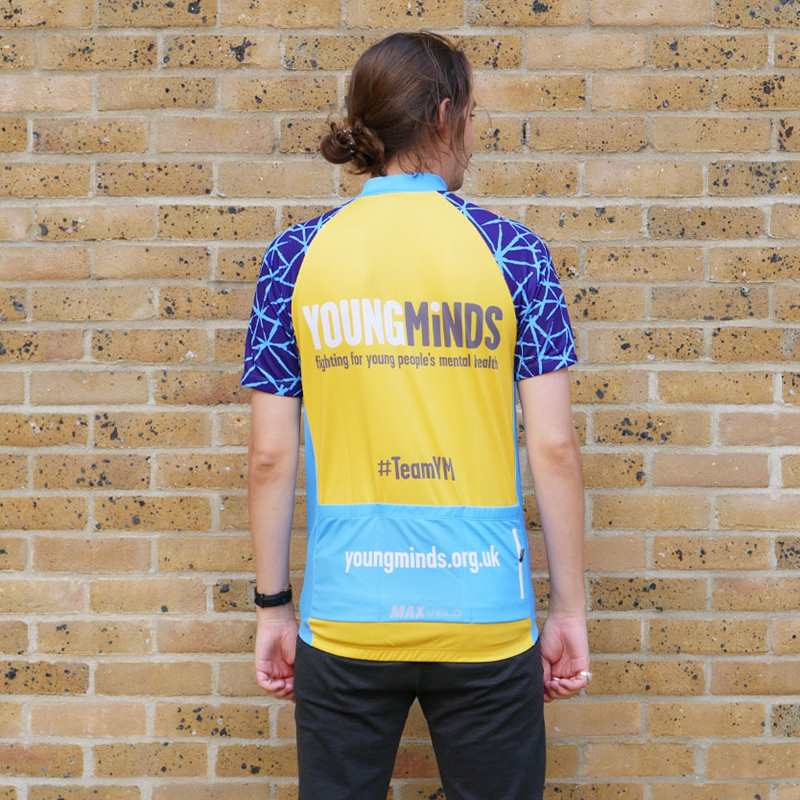 a man showing the back of YoungMinds cycling jersey