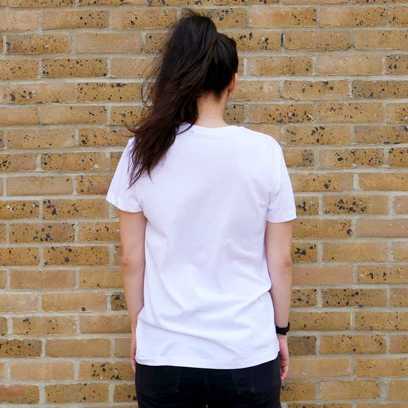 Back of a girl wearing YoungMinds white shirt