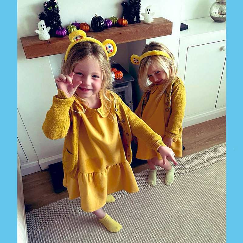 Two children from Brooklands Primary School dressed all in yellow with yellow bear ears.