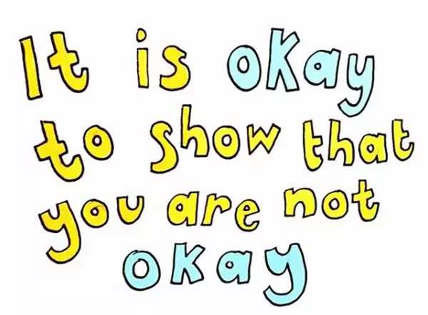 Text in yellow and light blue bubble writing reads 'it is okay to show that you are not okay'.
