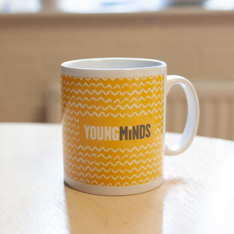 YoungMinds mug with yellow design