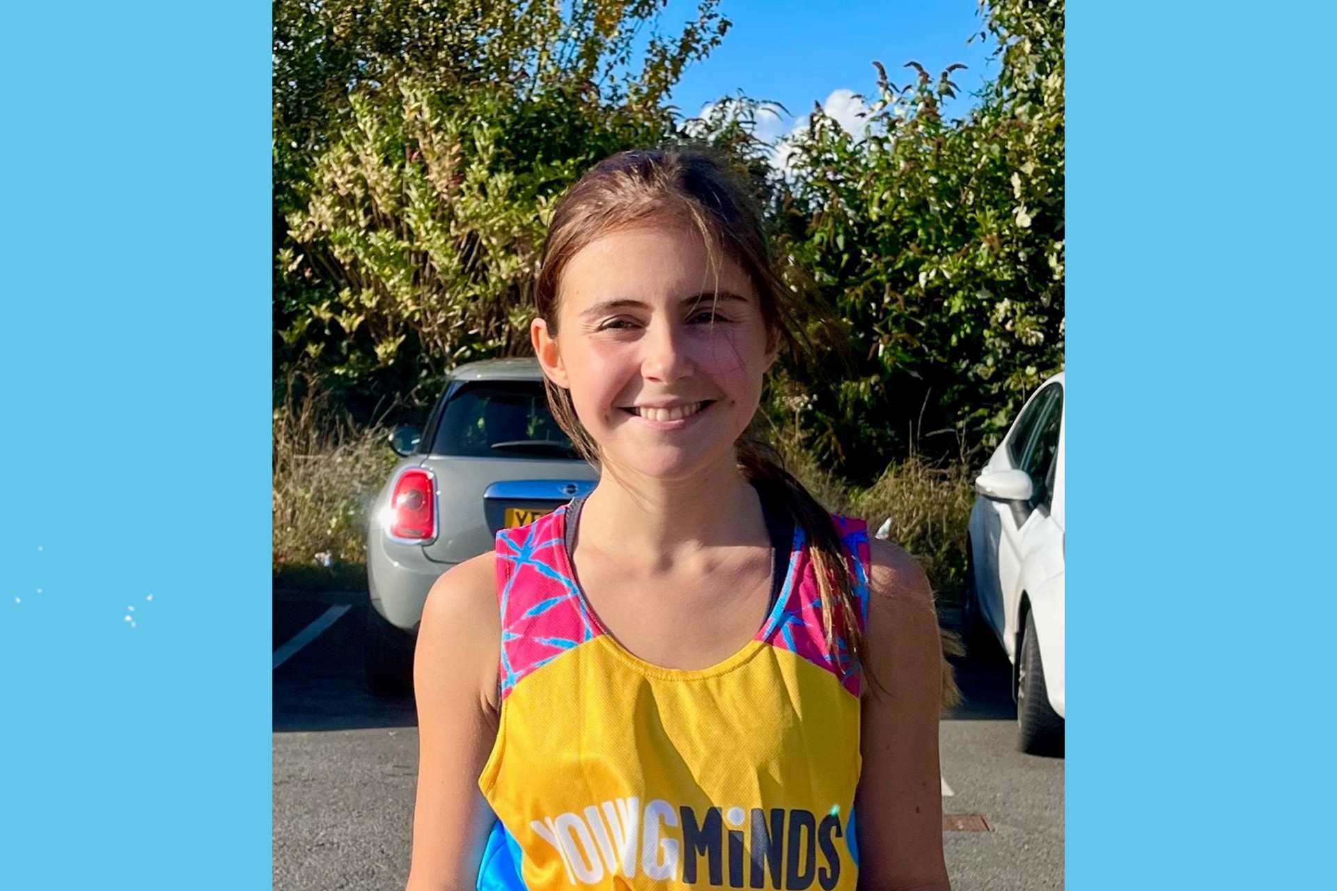 Alice Fortune smiling in a YoungMinds running vest.
