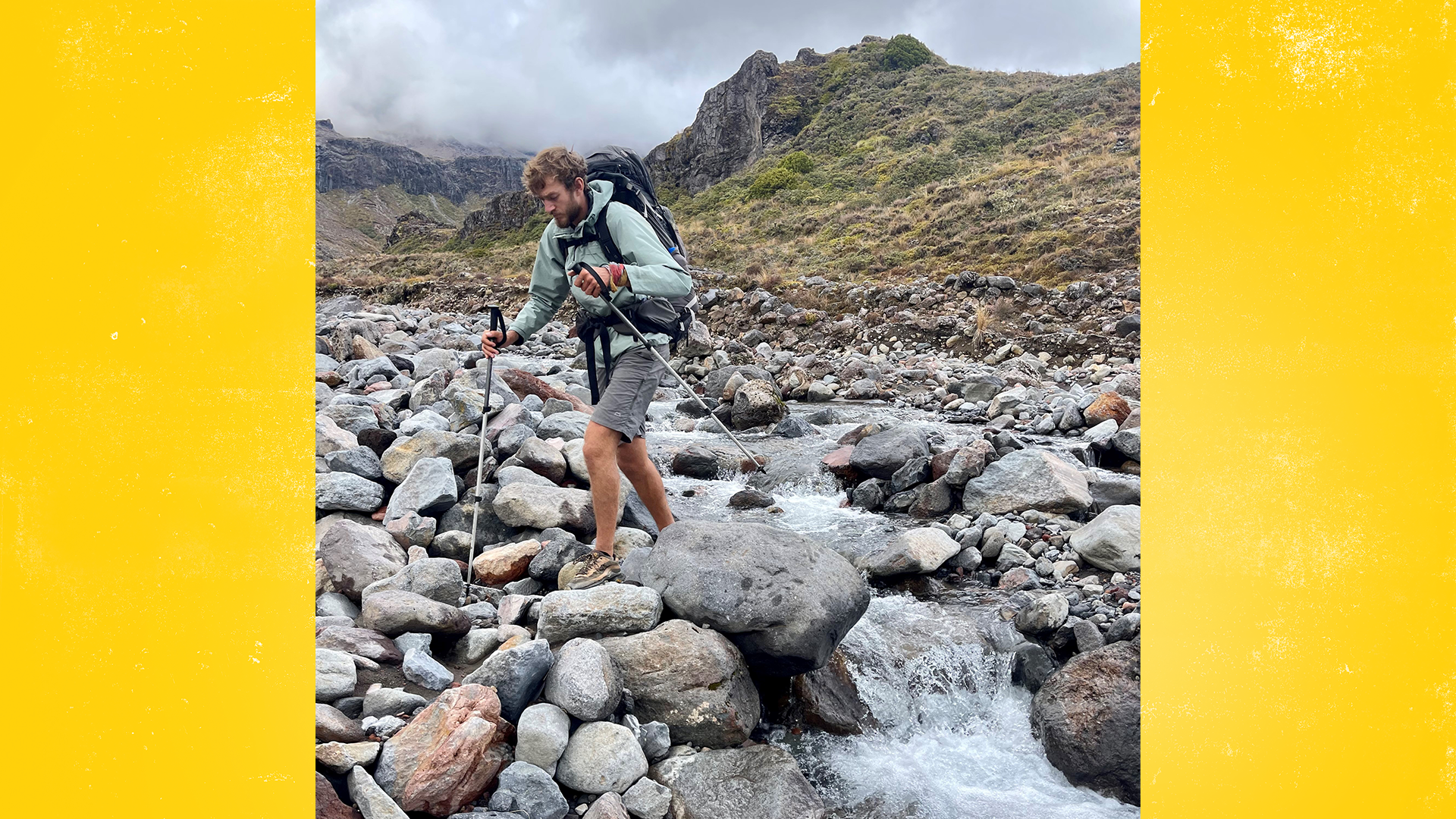 Cam hiking across the rocks.