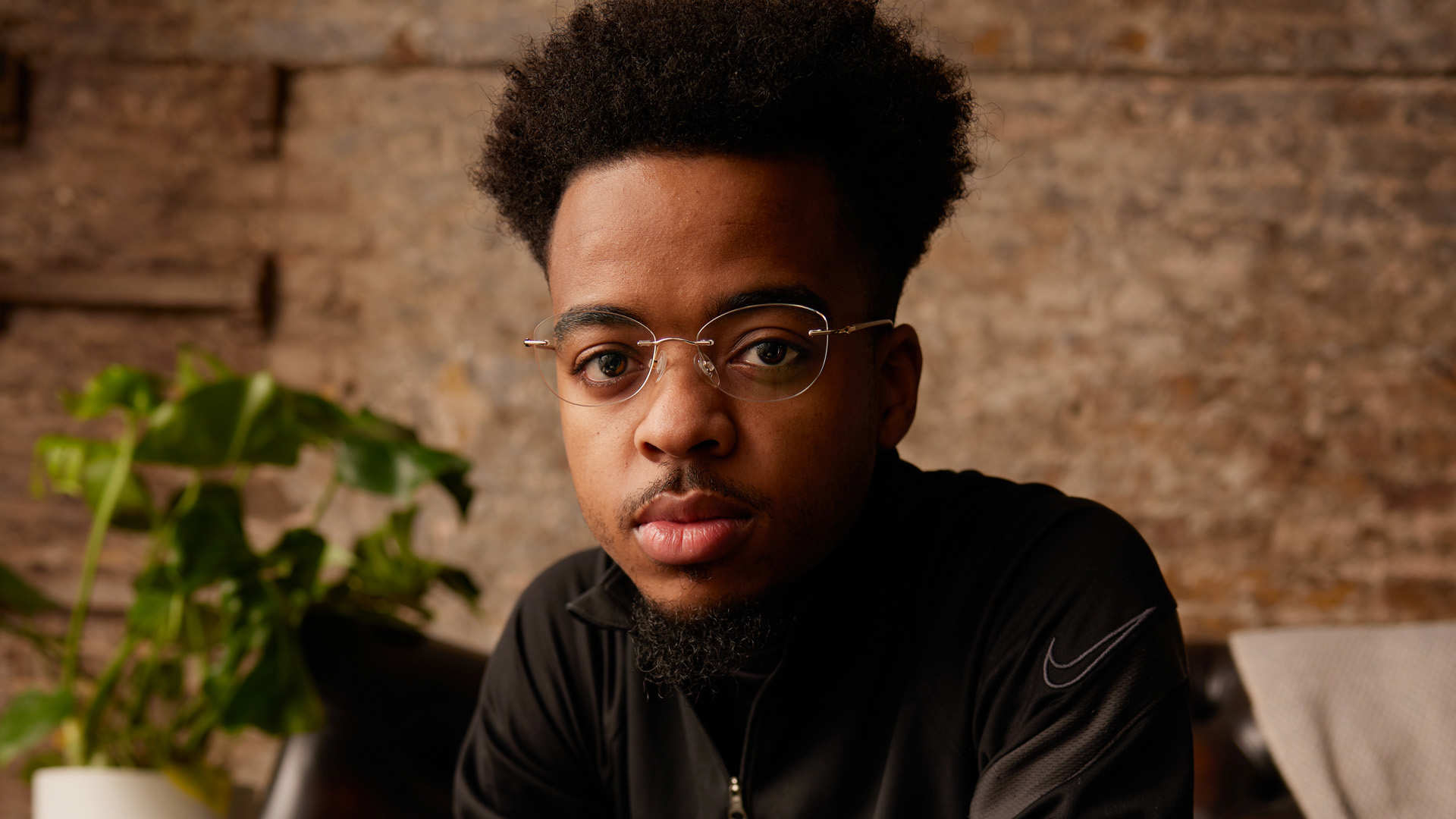 A young person looking directly at the camera.