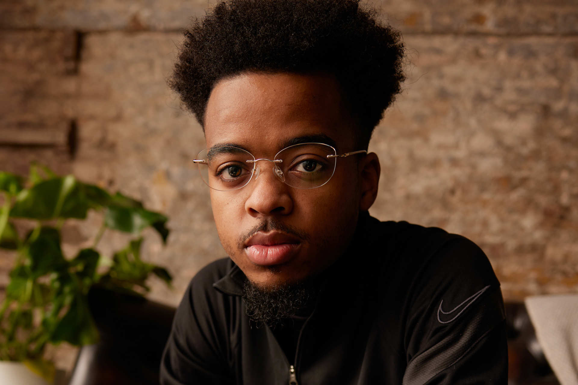 A young person looking directly at the camera.