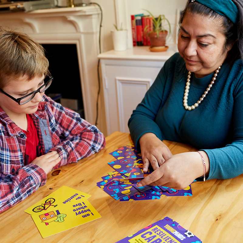mother and son playing YoungMinds resilience card primary pack