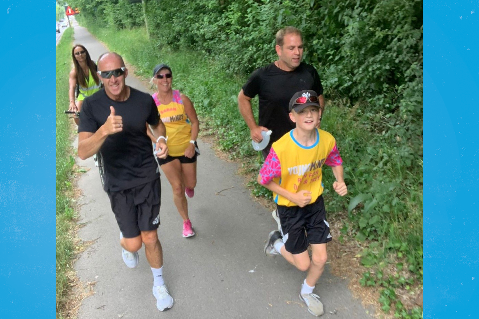 Alfie and Mike running, joined by Alfie's PE teacher and others who ran to show their support.