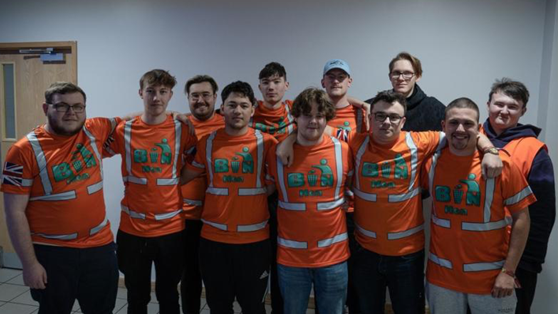 The Binmen group with their arms around each other.