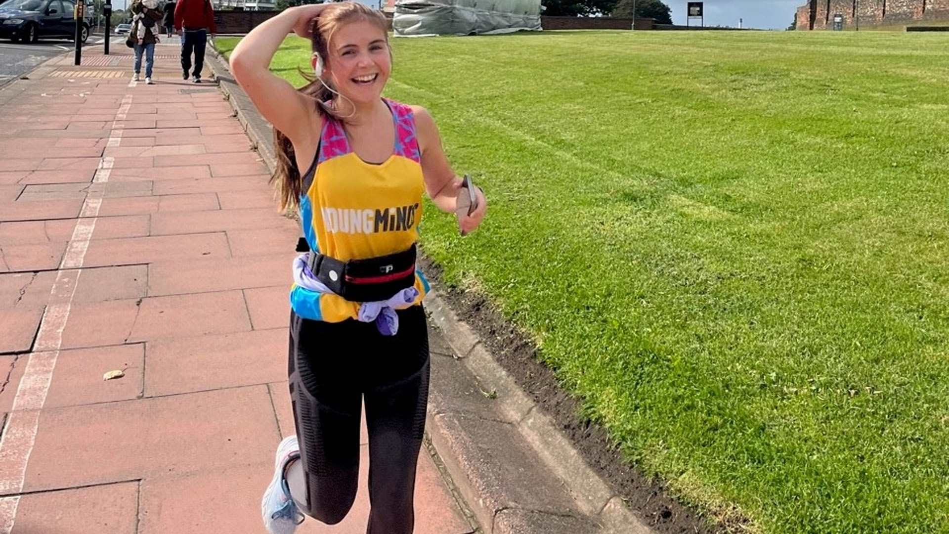 Alice Fortune running in a YoungMinds running vest.