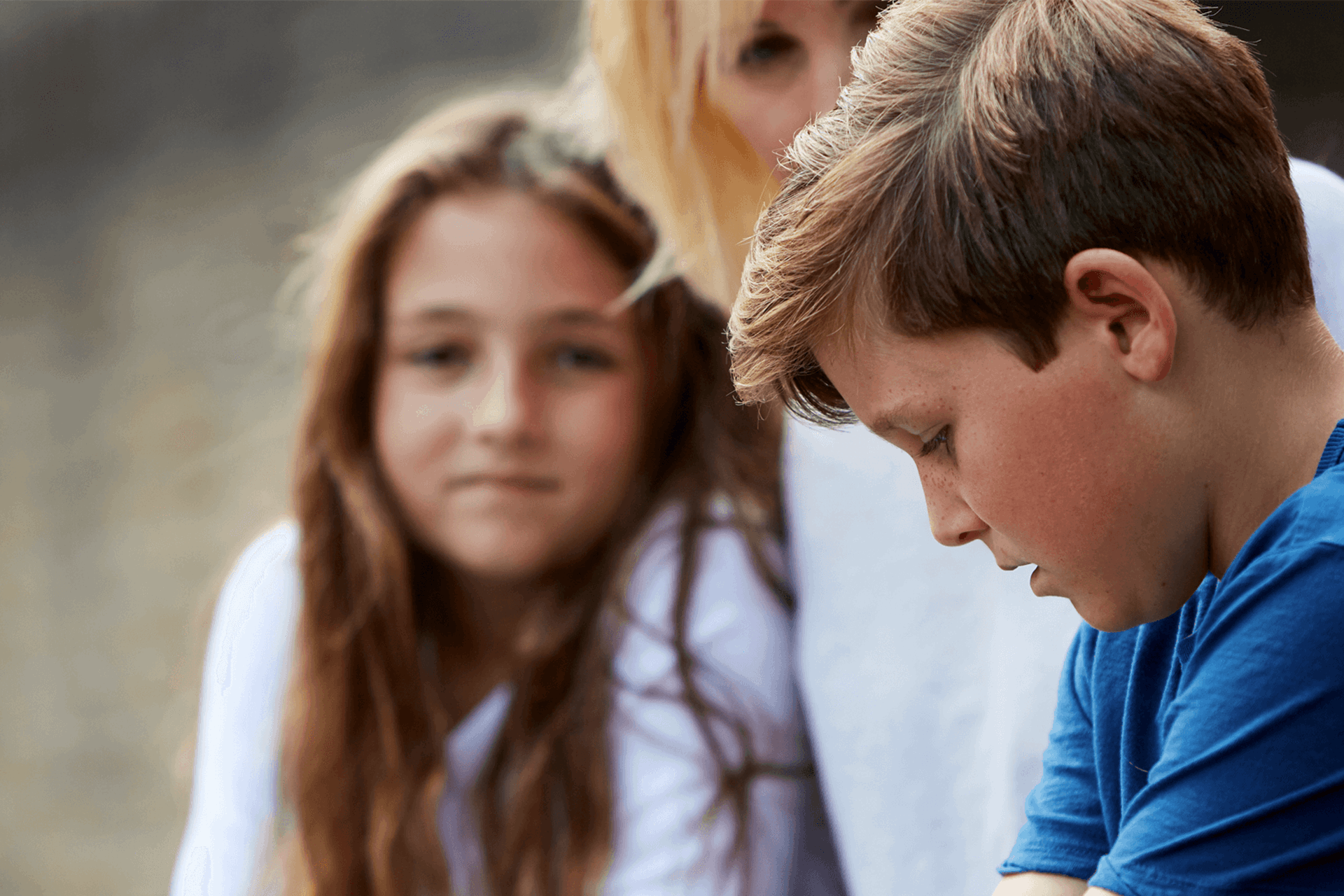 A mother talking to her son and daughter