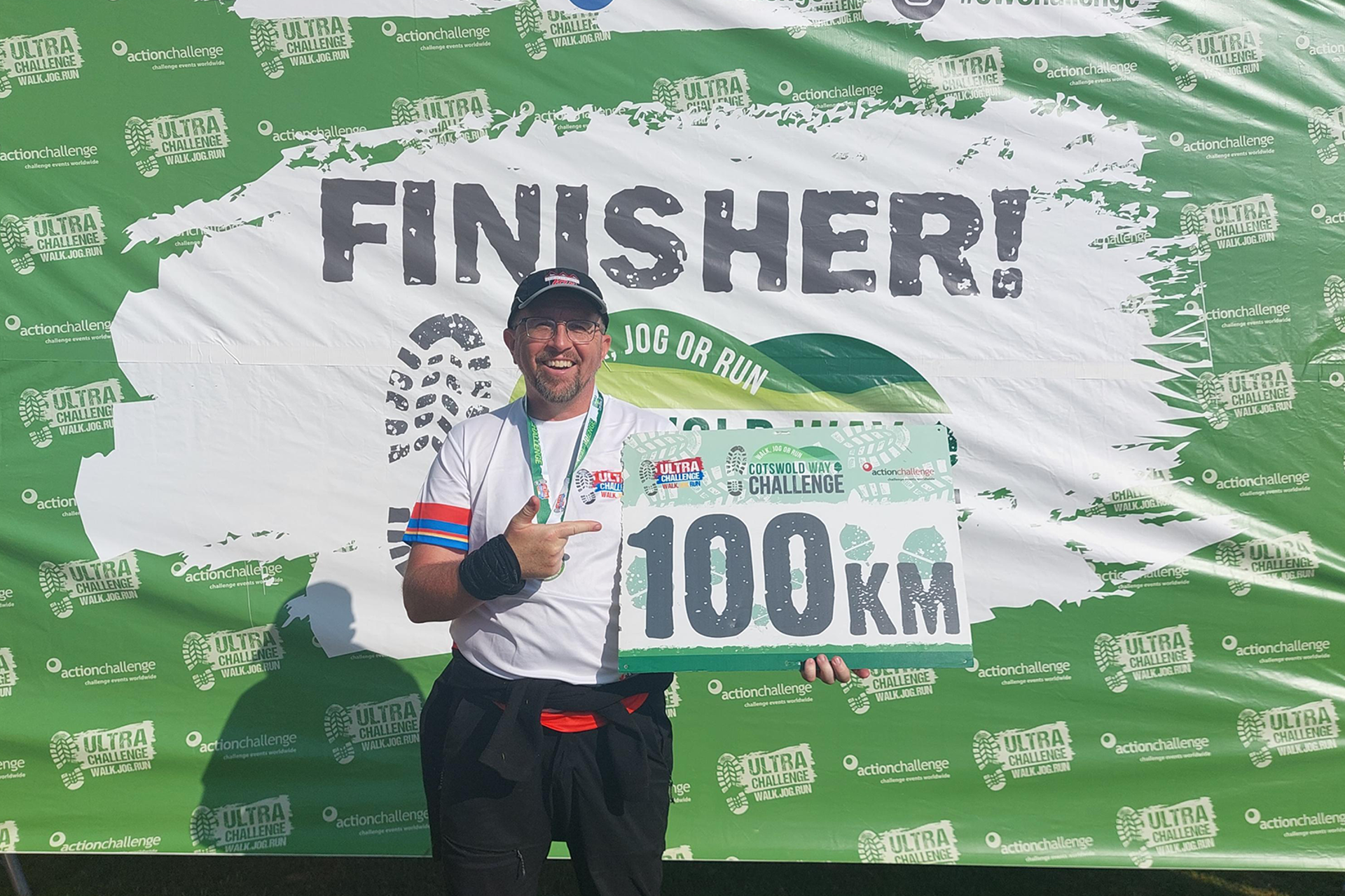 Tony holding his certificate at the end of the challenge.