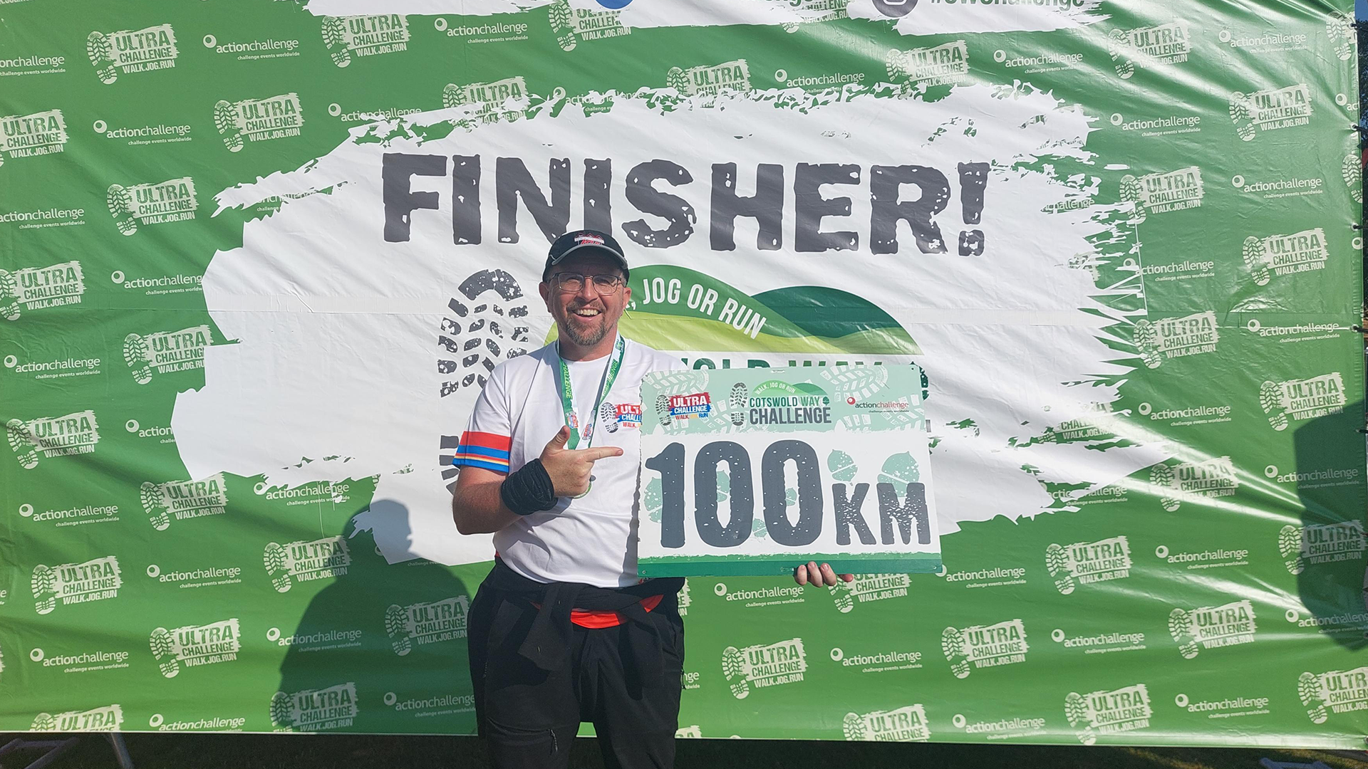 Tony holding his certificate at the end of the challenge.