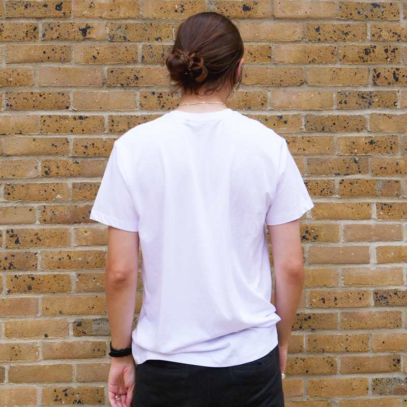 back of a boy wearing YoungMinds white shirt