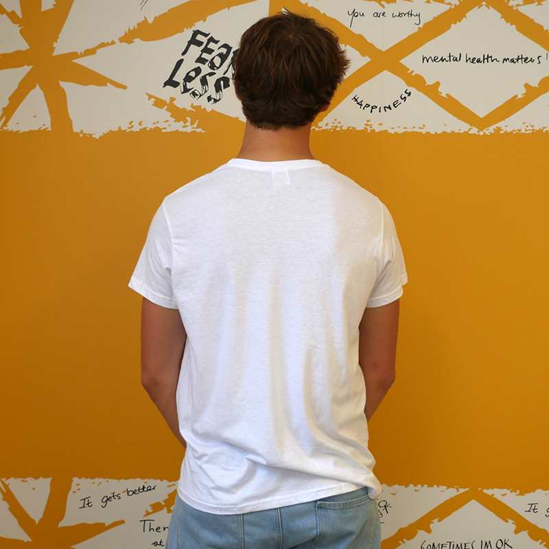 The back of a man wearing our Rubyetc bespoke 'You are here and you matter' graphic #HelloYellow T-shirt