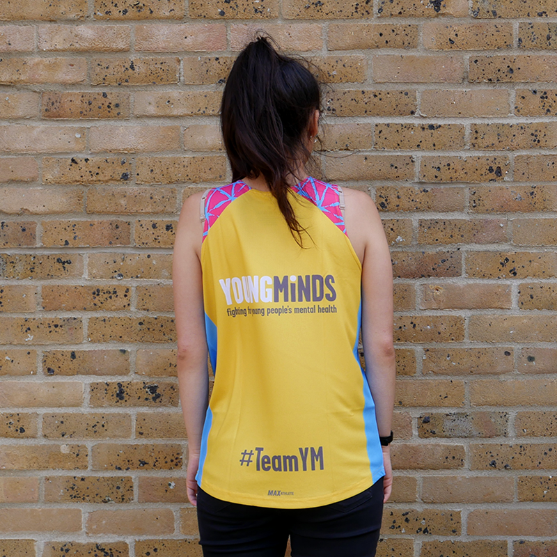 girl showing the back of YoungMinds running vest