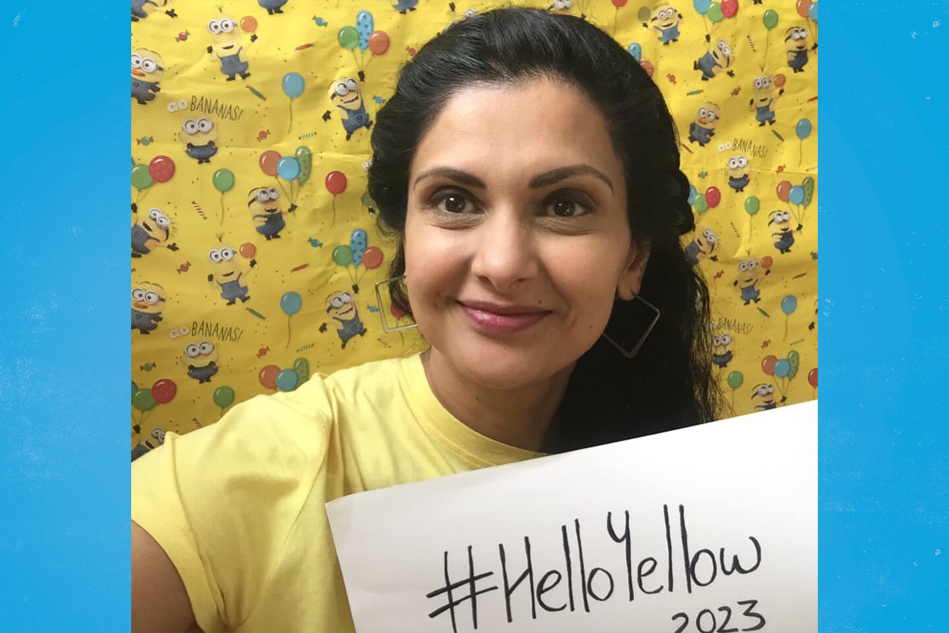 A CAMHS worker from Leeds holding a sign saying #HelloYelow 2023.