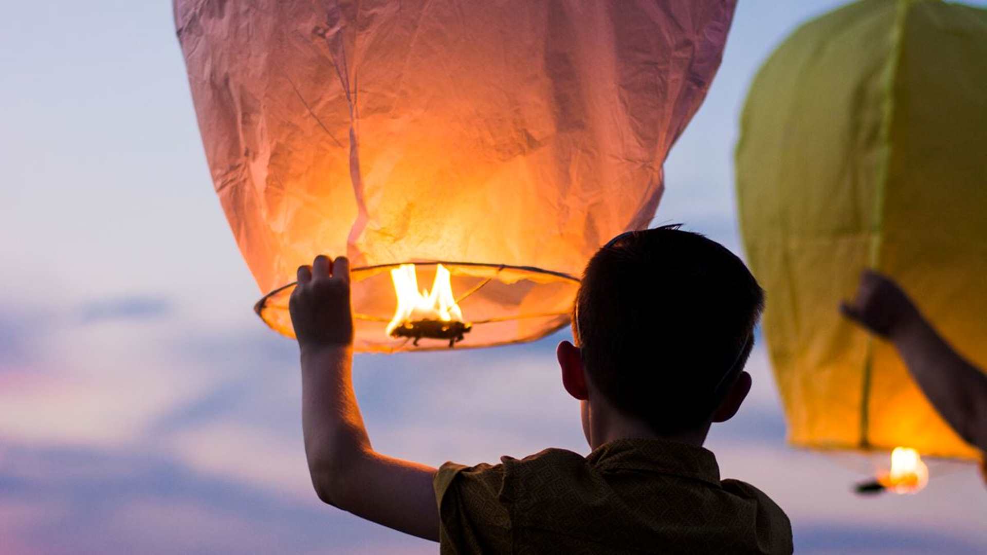 boy holding a lantern
