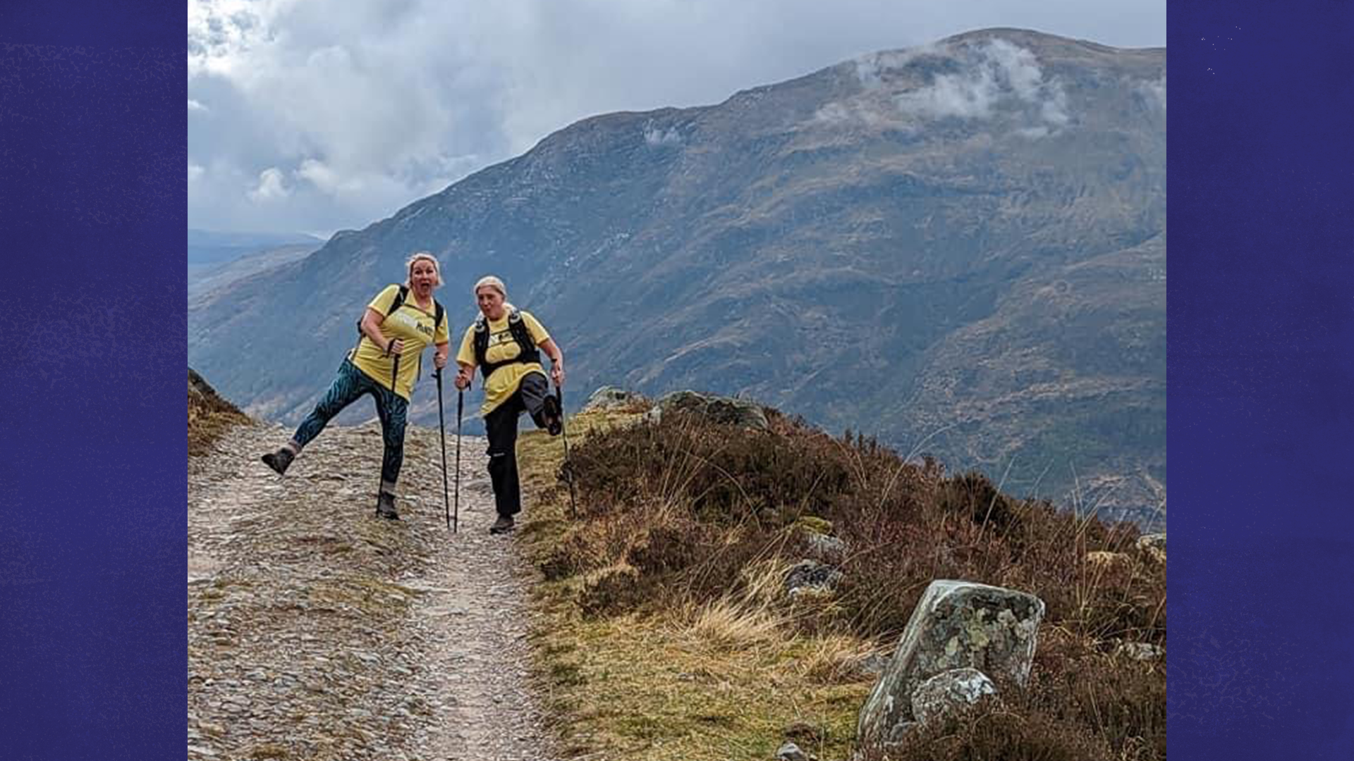 Two members of 4 Families Walking hiking up a hill.