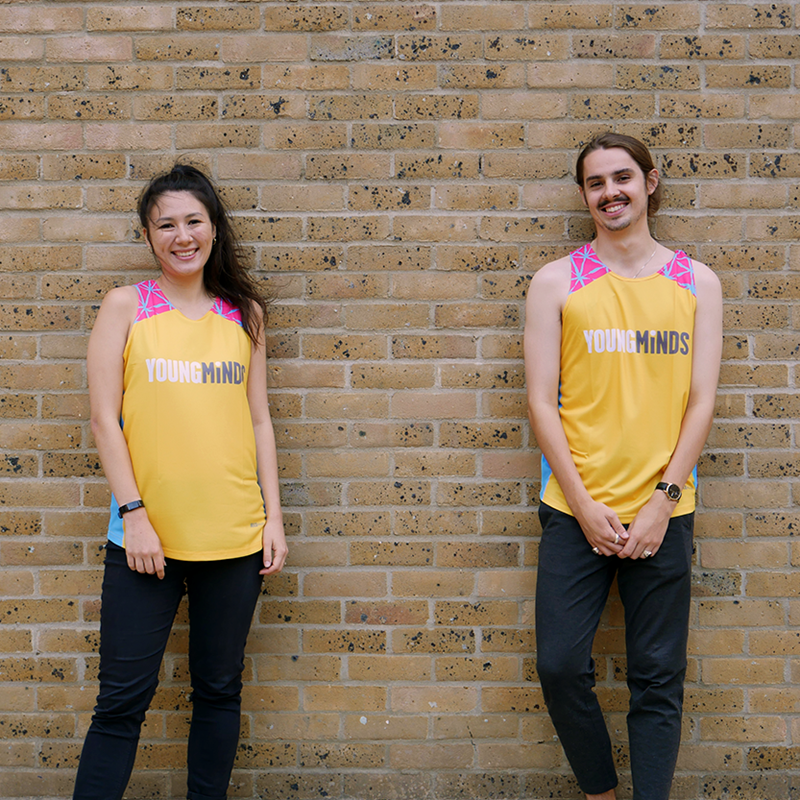 girl and boy smiling wearing YoungMinds running vest