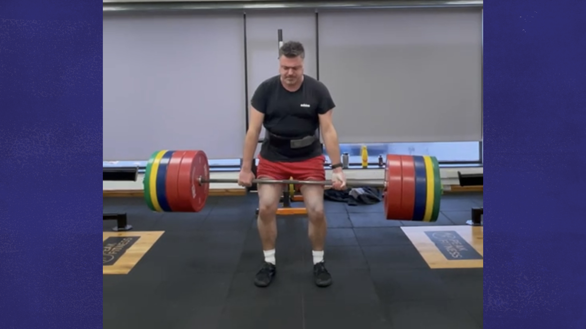 Craig lifting a heavyweight at the gym.